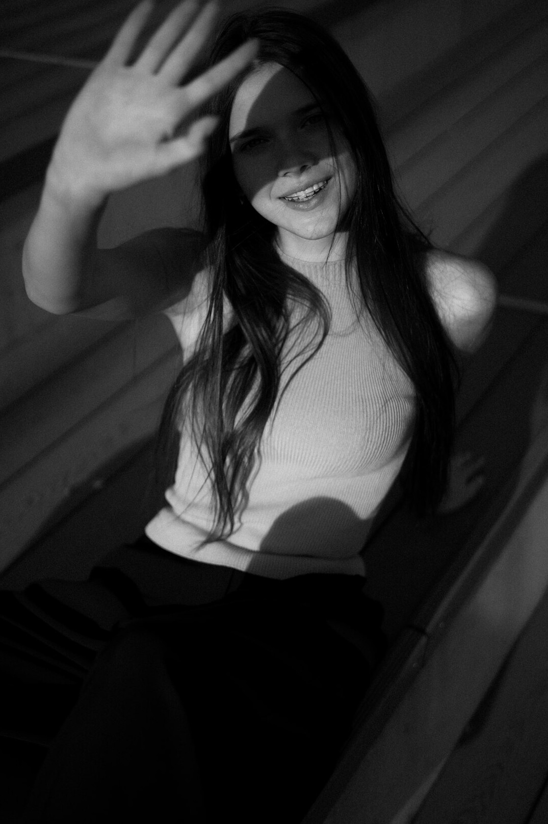 Portrait of a young woman with long hair smiling