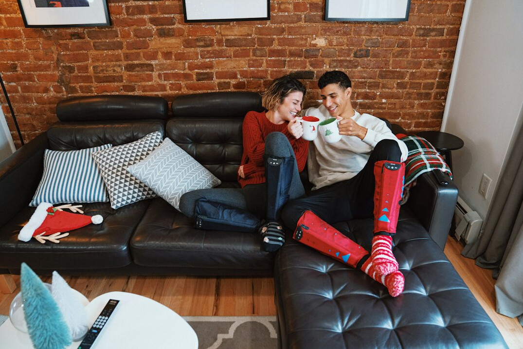 Friends having a relaxed conversation on a sofa