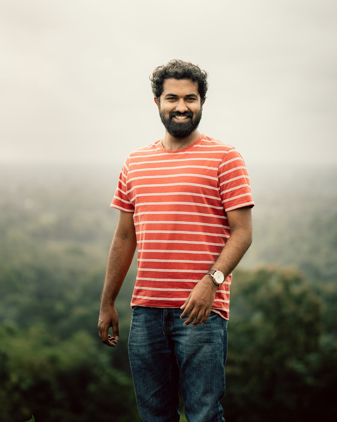 Portrait of a bearded man smiling outdoors