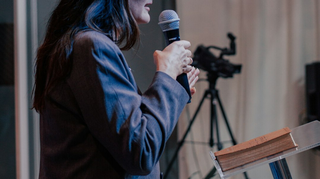 confident person speaking to audience