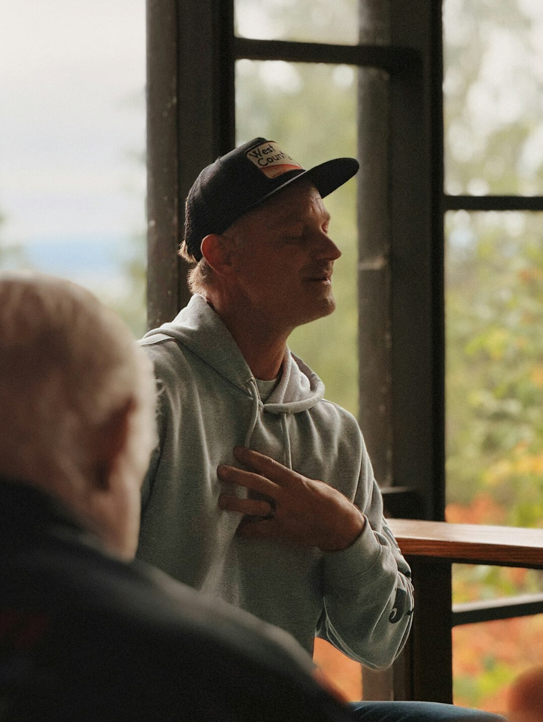 man reflecting during talk