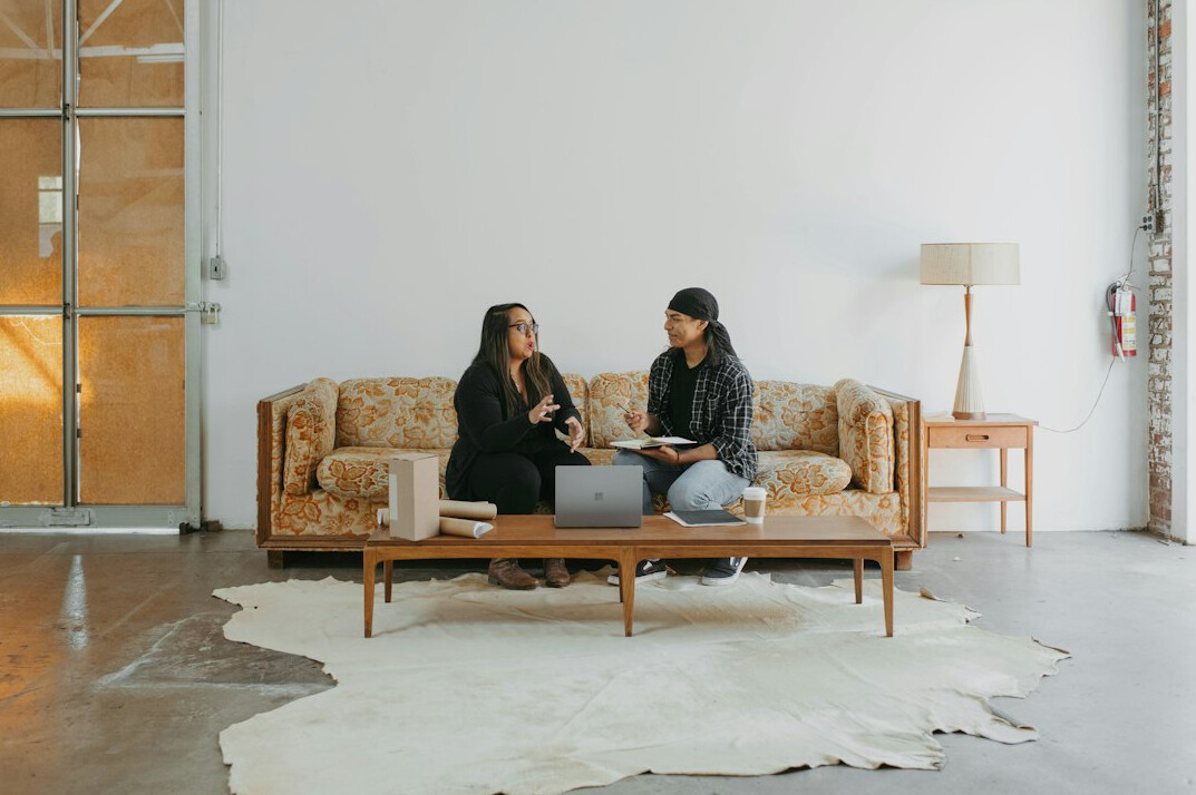 couple talking on couch at home